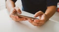 Man playing game on mobile phone. gamer boy playing video games holding SmartphoneÃÂ working mobile devices. cell telephone Royalty Free Stock Photo